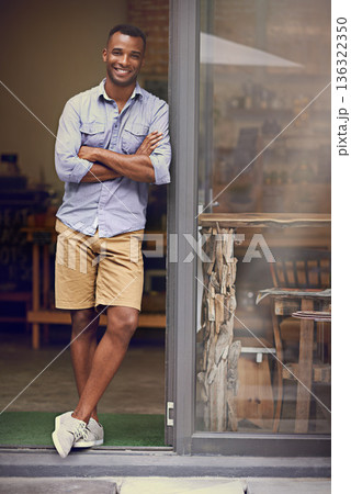 Black man, coffee shop and portrait of small business owner at front door with a smile. Entrepreneur african person as manager in a restaurant for hospitality service, career pride and startup goals Black man, coffee shop and portrait of small business owner at front door with a smile. Entrepreneur african person as manager in a restaurant for hospitality service, career pride and startup goals 136322350
