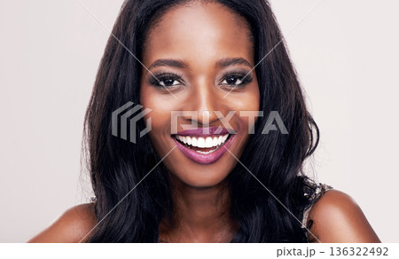 Beauty, face and smile portrait of black woman in studio for makeup, cosmetics or skincare. Happy african female model on a white background for facial care, skin glow and luxury or glamour aesthetic 136322492
