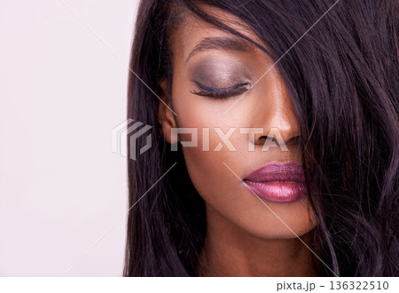 Beauty, makeup and face of black woman in studio for cosmetics, eyelash or hair extension. Headshot of african female model on a pink background for facial shine, skin glow and luxury aesthetic Beauty, makeup and face of black woman in studio for cosmetics, eyelash or hair extension. Headshot of african female model on a pink background for facial shine, skin glow and luxury aesthetic 136322510