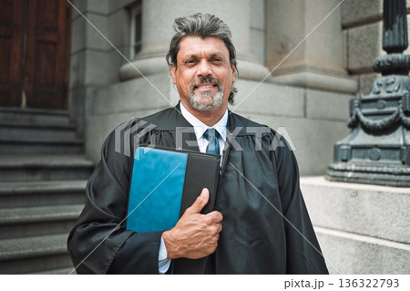Portrait, book and a senior man judge at court, outdoor in the city during recess from a legal case or trial. Smile, authority and power with a confident magistrate in an urban town to practice law Portrait, book and a senior man judge at court, outdoor in the city during recess from a legal case or trial. Smile, authority and power with a confident magistrate in an urban town to practice law 136322793