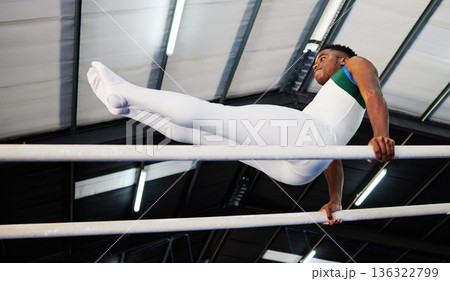 Strength, fitness and gymnast or male athlete with practicing for competition with african at gym. Gymnastics, sports and man with balance on beam for training with healthy body at arena or club. Strength, fitness and gymnast or male athlete with practicing for competition with african at gym. Gymnastics, sports and man with balance on beam for training with healthy body at arena or club. 136322799