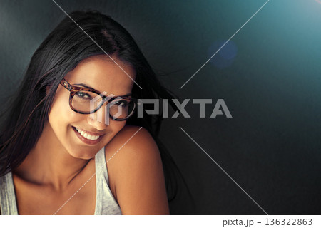 Woman, face and happy with glasses and vision with designer frame with prescription lens on studio background. Portrait, eye care and female model with fashion eyewear, optometry and mockup space 136322863
