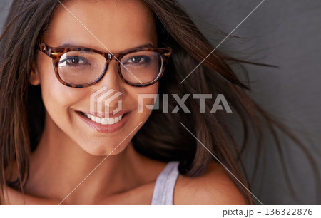 Woman, face and happy with glasses and eye care, vision with designer frame with prescription lens. Portrait, healthcare and female model with smile and fashion eyewear, optometry and health for eyes 136322876