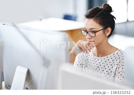 Business, thinking and woman with a computer, focus and connection with online reading, copy writer and creative. Female person, employee or consultant with a pc, search internet and editing project 136323252