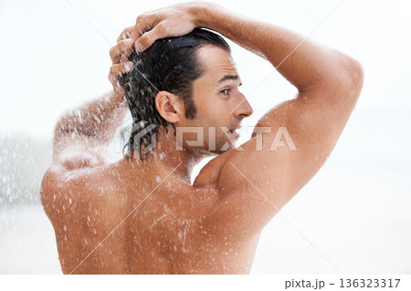 Clean, back view of a man in the shower and health wellness indoors. Cleaning in bathroom, muscular or wellbeing and rearview of wet male person showering for refreshing hygiene protection or washing 136323317