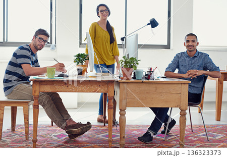Coworking, web designer portrait and team in office with work and collaboration of small business. Startup, teamwork and staff in a workplace with communication of group with graphic design project Coworking, web designer portrait and team in office with work and collaboration of small business. Startup, teamwork and staff in a workplace with communication of group with graphic design project 136323373