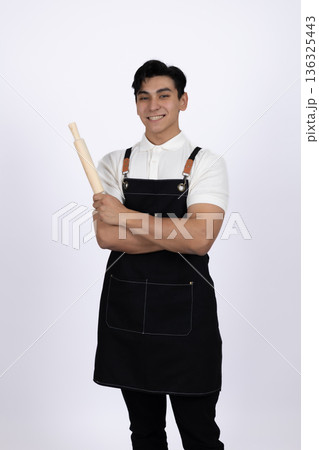 Professional chef holding kitchen tools and posing Professional chef holding kitchen tools and posing 136325443