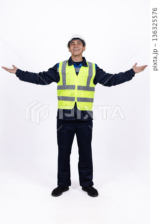 Professional engineer in high visibility vest opening arms Professional engineer in high visibility vest opening arms 136325576