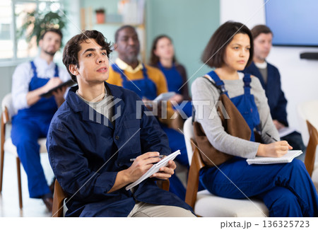 Portrait of an attentive young worker on refresher course Portrait of an attentive young worker on refresher course 136325723