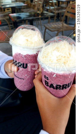 ice cream in the hand of a woman holding ice cream ice cream in the hand of a woman holding ice cream 136326119