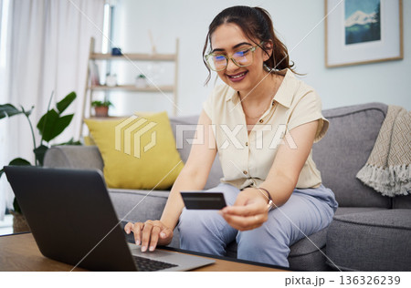 Woman, credit card and ecommerce on laptop in home for digital payment, fintech password and online shopping. Happy female customer, computer and banking code for financial bills, budget and account Woman, credit card and ecommerce on laptop in home for digital payment, fintech password and online shopping. Happy female customer, computer and banking code for financial bills, budget and account 136326239
