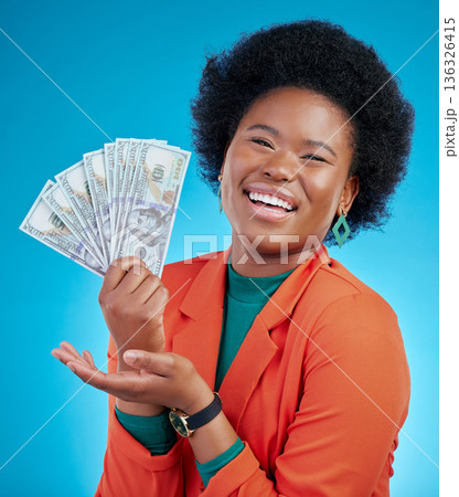 Money, offer and business woman in portrait for winning, cash and lottery fan on blue background. Face, investment and rich african person or winner with bonus, cashback and financial loan in studio Money, offer and business woman in portrait for winning, cash and lottery fan on blue background. Face, investment and rich african person or winner with bonus, cashback and financial loan in studio 136326415