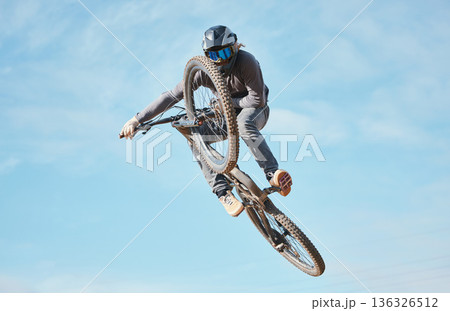 Extreme sports, bike jump and cyclist cycling a bicycle for competition stunt routine or training speed in mockup space. Skill, contest and athlete workout or practice sky or air trick for fitness Extreme sports, bike jump and cyclist cycling a bicycle for competition stunt routine or training speed in mockup space. Skill, contest and athlete workout or practice sky or air trick for fitness 136326512