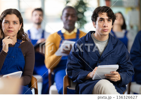Portrait of an attentive young worker on refresher course 136326627
