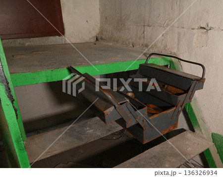 opened old metal toolbox on the stairs opened old metal toolbox on the stairs 136326934