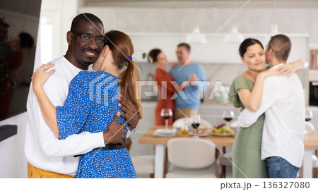 Happy middle-aged men and women doing slow dance in pairs 136327080