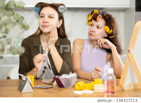 Adult and young women use face masks 136327213