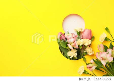 Spring flowers celebrate Women's Day vibrantly on yellow background Spring flowers celebrate Women's Day vibrantly on yellow background 136327995