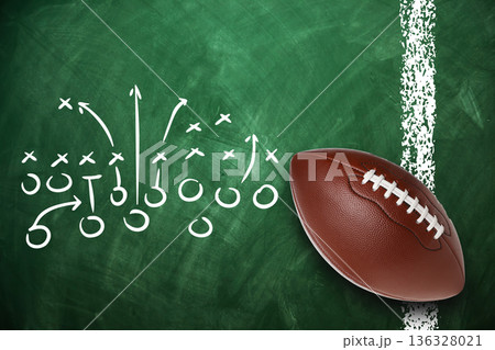 Detailed football play diagram with a ball on a chalkboard 136328021