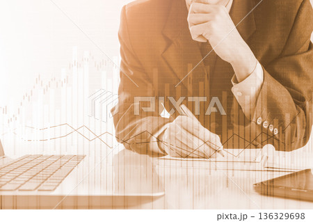 Stock market or forex trading graph and candlestick chart suitable for financial investment concept. Economy trends background for business idea and all art work design. Abstract finance background. Stock market or forex trading graph and candlestick chart suitable for financial investment concept. Economy trends background for business idea and all art work design. Abstract finance background. 136329698