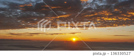 Banner Golden sky sunrise dramatic beautiful landscape view. Dawn sky gold dusk time cloudscape with sunlight. Panorama Dramatic sunset scenic landscape. Beautiful landscape nature with copy space Banner Golden sky sunrise dramatic beautiful landscape view. Dawn sky gold dusk time cloudscape with sunlight. Panorama Dramatic sunset scenic landscape. Beautiful landscape nature with copy space 136330527