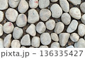 Texture of large smooth stones decoratively laid out on the ground 136335427