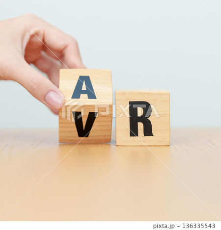hand change wooden block from VR to AR, VIRTUAL and AUGMENTED REALITY, MR, Mixed Reality, XR, Extended, Metaverse and Immersive Technology concept hand change wooden block from VR to AR, VIRTUAL and AUGMENTED REALITY, MR, Mixed Reality, XR, Extended, Metaverse and Immersive Technology concept 136335543