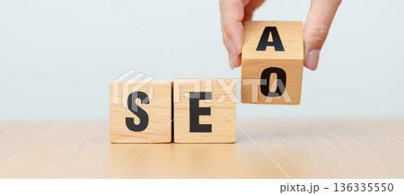 Hand change Wooden block from SEA to SEO. Search Engine Optimization, SEM, Advertising, Marketing, Idea, Strategy, Keyword, Content and technology concept 136335550