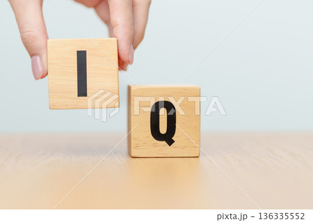hand change wooden block from IQ to EQ, balance between intelligence quotient and emotional quotient, AQ Adversity, MQ, Moral, SQ and Social quotient concepts hand change wooden block from IQ to EQ, balance between intelligence quotient and emotional quotient, AQ Adversity, MQ, Moral, SQ and Social quotient concepts 136335552