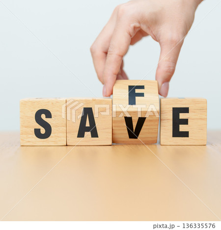 hand change wooden block Save to Safe. money savings, risk management, investment, financial security and business concept hand change wooden block Save to Safe. money savings, risk management, investment, financial security and business concept 136335576