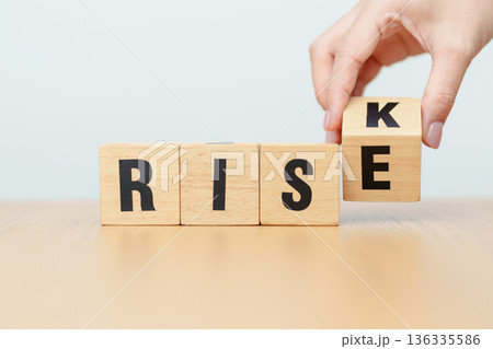 hand change wooden block Rise to Risk. High Risk High Return, strategy, analysis, marketing, risk management, wealth, opportunity and Crisis concepts hand change wooden block Rise to Risk. High Risk High Return, strategy, analysis, marketing, risk management, wealth, opportunity and Crisis concepts 136335586