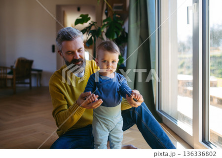 Father with little toddler son at home. 136336802