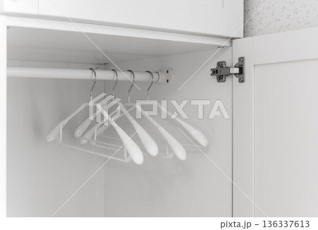 Open wardrobe with hangers Open wardrobe with hangers 136337613