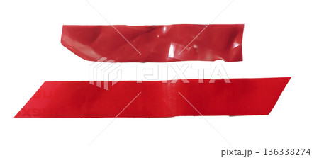 red adhesive tape strips with glossy plastic surface, folds, and slight wrinkles. Long horizontal 136338274