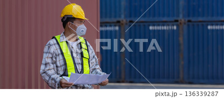 Foreman or worker work at Container cargo site check up goods in container. Foreman or worker work at Container cargo site check up goods in container. 136339287