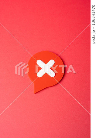 A comment with a disclaimer or prohibition symbol. Disagreement, denial and non-recognition. Visual metaphor for content moderation, user rights, and clear communication of refusal in digital space 136341470