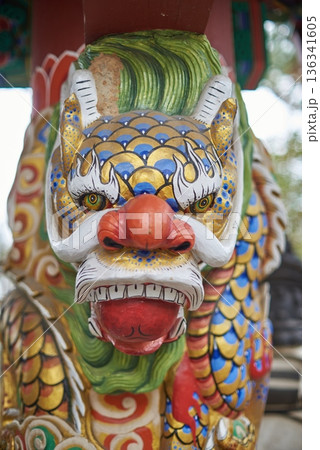 Colorful dragon guardian statue head in Asian temple Colorful dragon guardian statue head in Asian temple 136341605