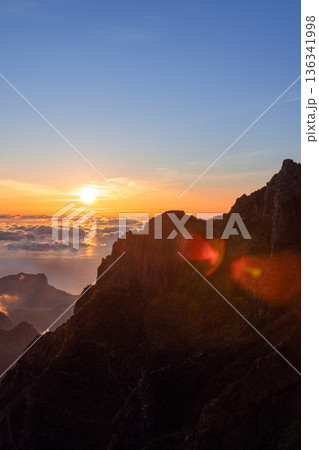 Cliff ridge at sunrise on Pico do Arieiro Madeira Portugal, glowing cloud ocean 136341998