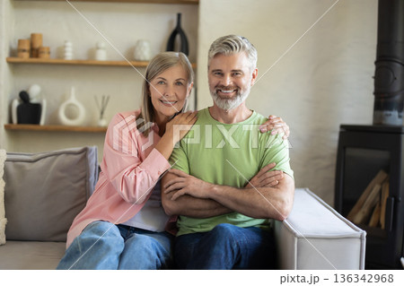 Mature partners relaxed indoors enjoying time together 136342968