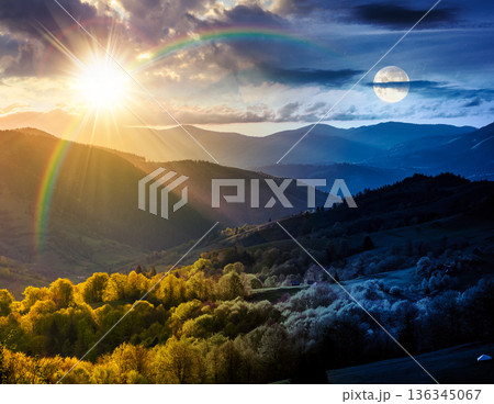gorgeous countryside in spring. day and night time change concept. beautiful mountain landscape with cloudy sky over the forested rolling hills with sun and moon at twilight. astrology wallpaper gorgeous countryside in spring. day and night time change concept. beautiful mountain landscape with cloudy sky over the forested rolling hills with sun and moon at twilight. astrology wallpaper 136345067