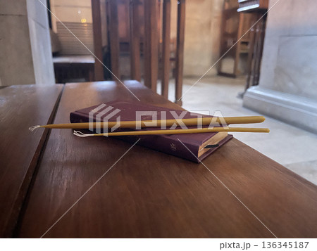 bible with candles in orthodox chirch 136345187