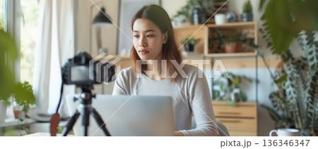 Young woman recording online video lesson at home office 136346347