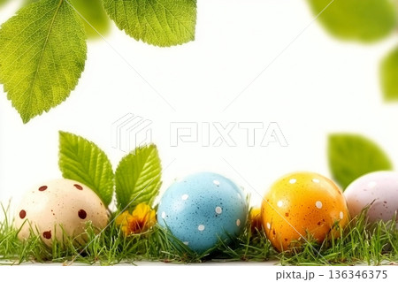 A collection of painted easter eggs under bright green tree leaves celebrating a Happy Easter in spring with green short meadow grass against an isolated white background. A collection of painted easter eggs under bright green tree leaves celebrating a Happy Easter in spring with green short meadow grass against an isolated white background. 136346375