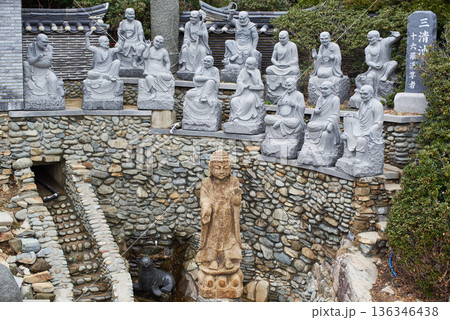 Buddhist statues in Haedong Yonggungsa Buddhist temple in Gijang-gun in Busan, South Korea 136346438