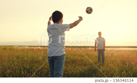 People nature, child kid playing ball lawn outdoors, happy childhood schoolchildren sunset, boys and their friends play football on the grass., human, children having fun on the lawn with a soccer 136348114