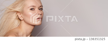 Freshfaced Woman With Soft Aura. Pure And Luminous Complexion Complemented By Subtle Makeup Look. Natural looking Woman With Dewy Skin Exudes Calmness And Understated Elegance In Studio Setting Freshfaced Woman With Soft Aura. Pure And Luminous Complexion Complemented By Subtle Makeup Look. Natural looking Woman With Dewy Skin Exudes Calmness And Understated Elegance In Studio Setting 136351325
