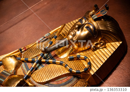 Fire lighted scene of some closeup details of an ancient Egyptian artifact. Fire lighted scene of some closeup details of an ancient Egyptian artifact. 136353310