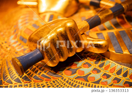 Hand of Tutankhamun Holding Royal Crook and Flail.Ancient Egyptian power symbols Hand of Tutankhamun Holding Royal Crook and Flail.Ancient Egyptian power symbols 136353313