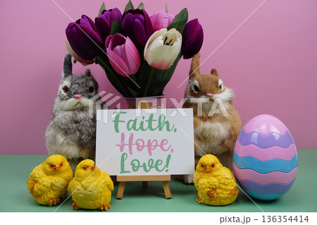 Faith, Hope, Love! text with easter elements decoration on pink and green background Faith, Hope, Love! text with easter elements decoration on pink and green background 136354414