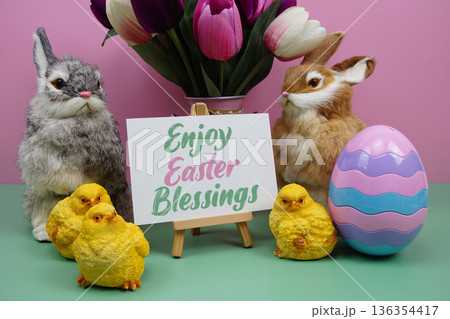 Enjoy Easter Blessings text with easter elements decoration on pink and green background Enjoy Easter Blessings text with easter elements decoration on pink and green background 136354417